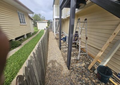 After photo showing clean side of house after rubbish has been removed.